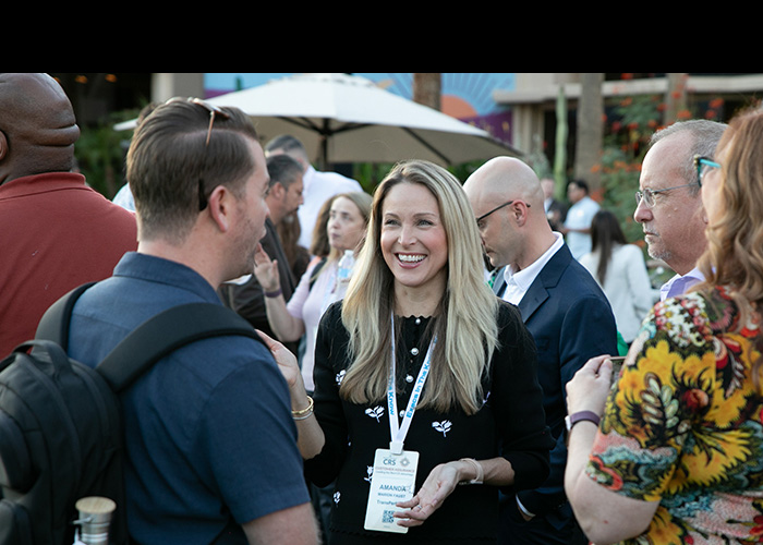 CRS attendees in conversation