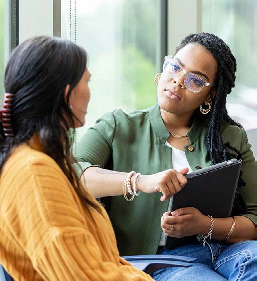 Two colleagues having a supportive conversation.