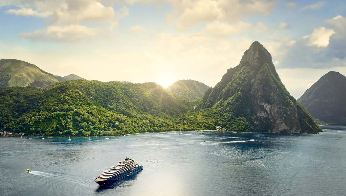 The Ritz-Carlton Yacht Collection yacht in a tropical island bay
