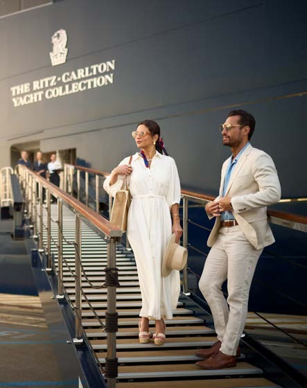 Guests on a staircase aboard the yacht